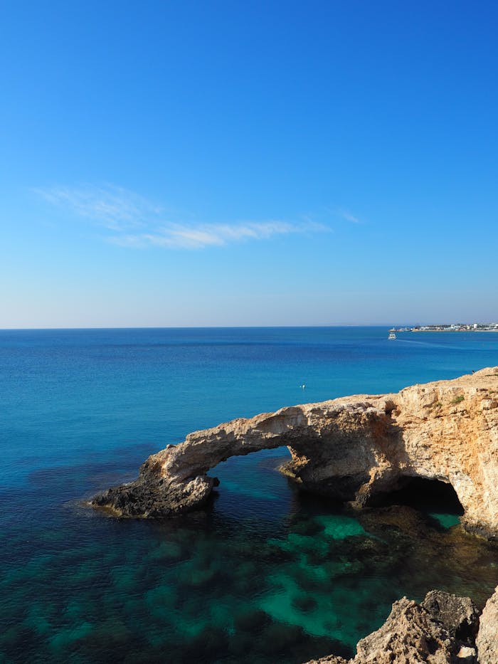 Beautiful view of the Mediterranean Sea and a natural rock arch along the coast of Cyprus.